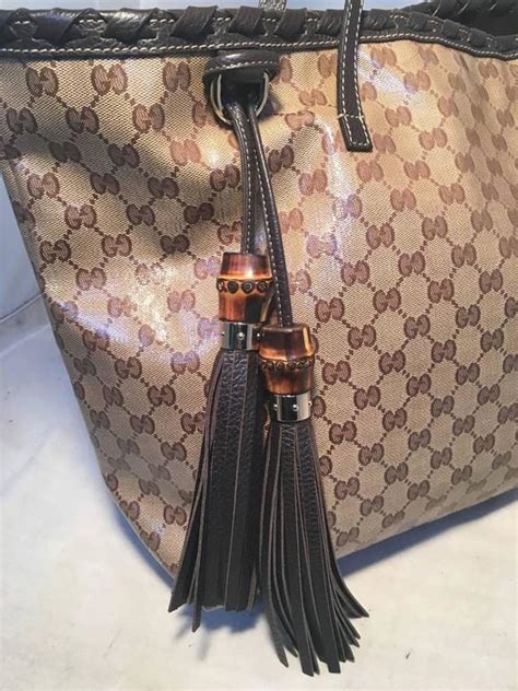 gucci coated monogram double chain handle with tassel handbag large|history of Gucci handbags.